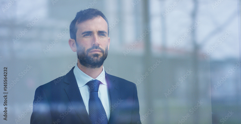 A businessman in a suit uses holography and augmented reality to see in 3D graphics financial economics in his office in a skyscraper. Concept: immersive technology, business, economy, futuristic A businessman in a suit uses holography and augmented reality to see in 3D graphics financial economics in his office in a skyscraper. Concept: immersive technology, business, economy, futuristic