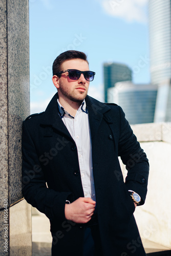 young businessman with a beard and glasses