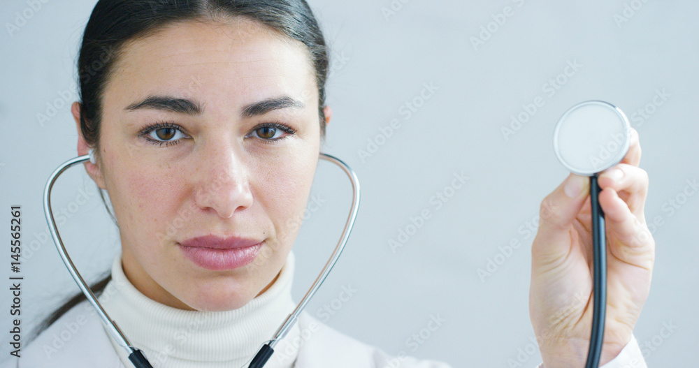 close up portrait of woman doctor with stethoscope ready for visit in hospital or clinic. close up portrait of woman doctor with stethoscope ready for visit in hospital or clinic.