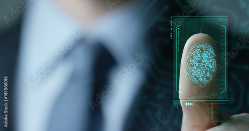 Фотография businessman scan fingerprint biometric identity and approval