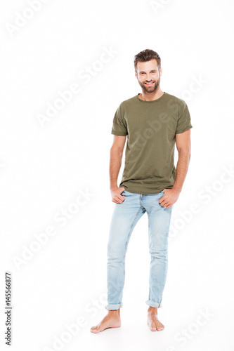 Happy young man posing isolated over white background