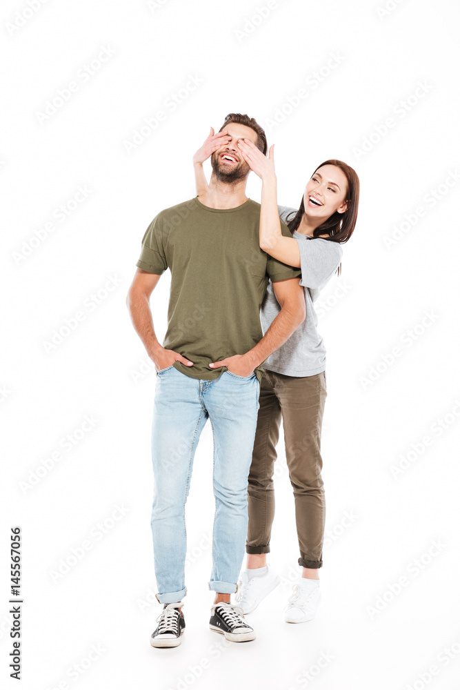Smiling young loving couple standing isolated Smiling young loving couple standing isolated