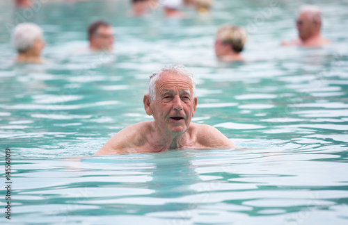 Senior man in swimming pool © Budimir Jevtic