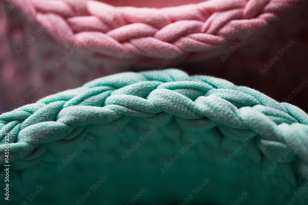Baskets - turquoise and pink crochet around the circle of knitting yarn, made of cloth.Close