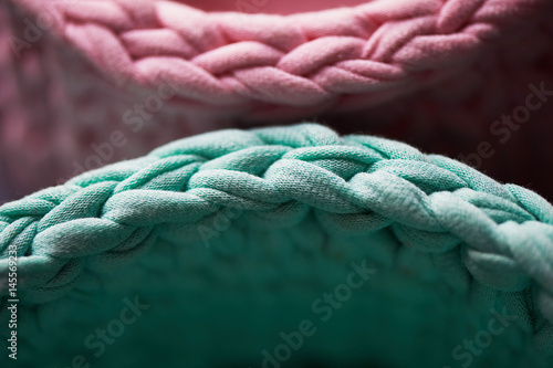 Baskets - turquoise and pink crochet around the circle of knitting yarn, made of cloth.Close