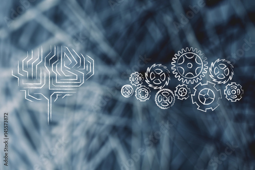 electronic brain next to complex gearwheel mechanism photo