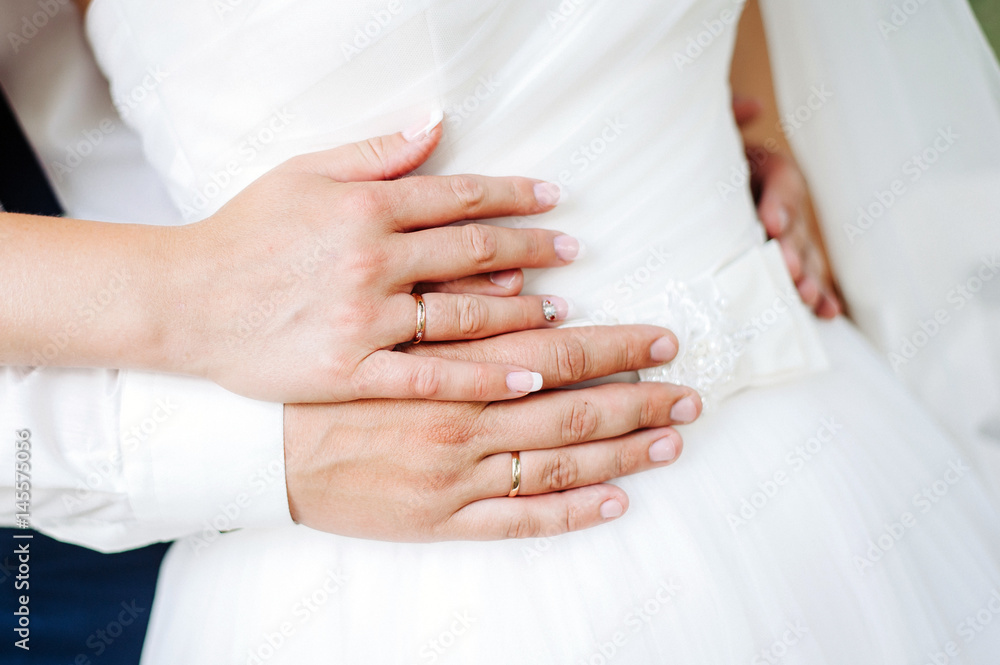 Hands of newlyweds with wedding rings. Hands of newlyweds with wedding rings.