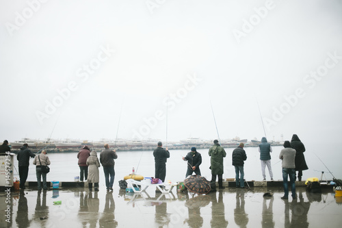 Fishermen catch fish in the sea. Fishermen in Yalta
