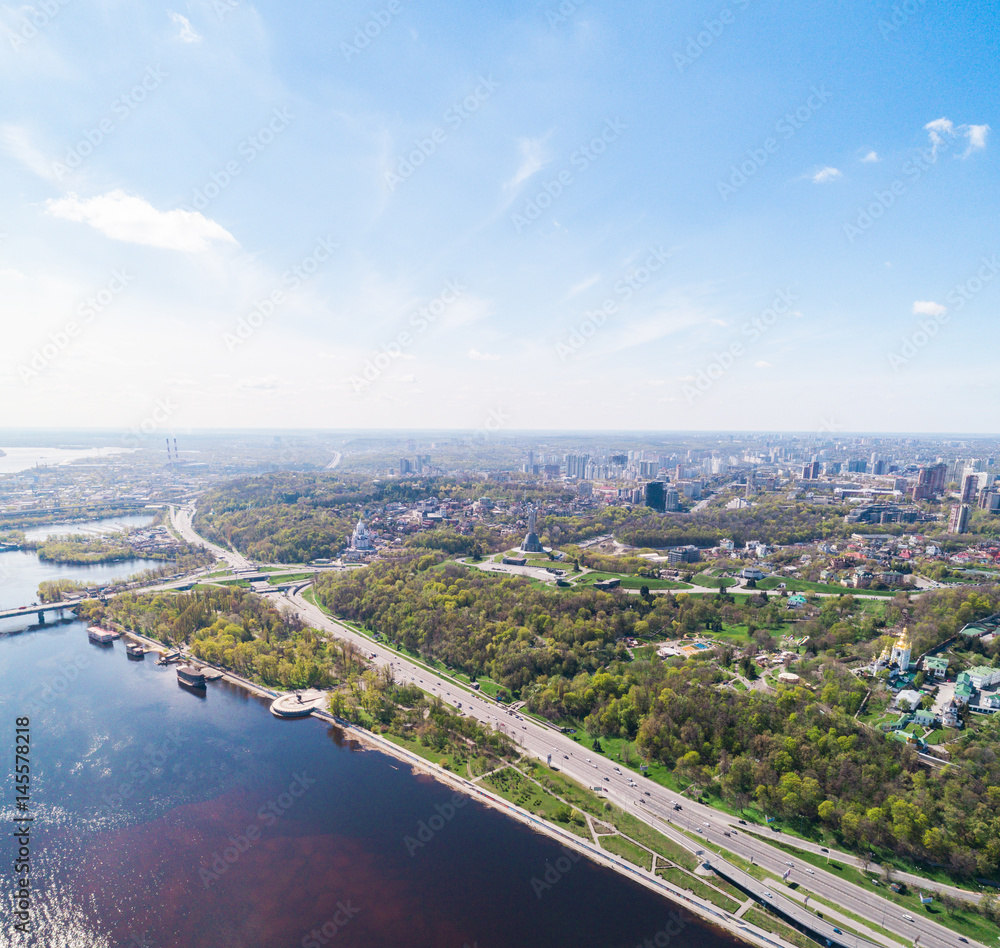 Panoramic view of the city of Kiev in the spring. Mother Land and Park of Glory view. Aerial view, from above. Outdoor.