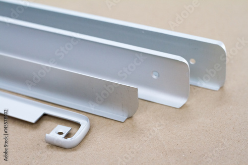 Bent metal profile channel. Furniture fittings.