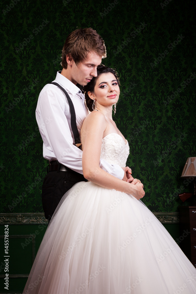 Beautiful inlove bride and groom in vintage interior. Happiness and marriage