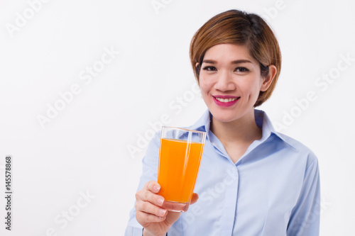 healthy asian woman holding glass of orange juice