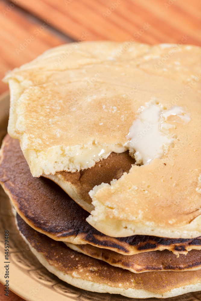 Closeup macro of american pancakes stuffed with chocolate cream on the plate