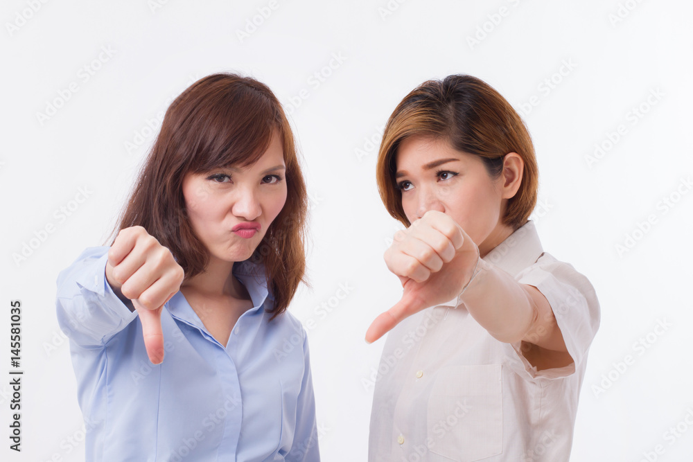 frustrated, angry women giving thumb down pose frustrated, angry women giving thumb down pose