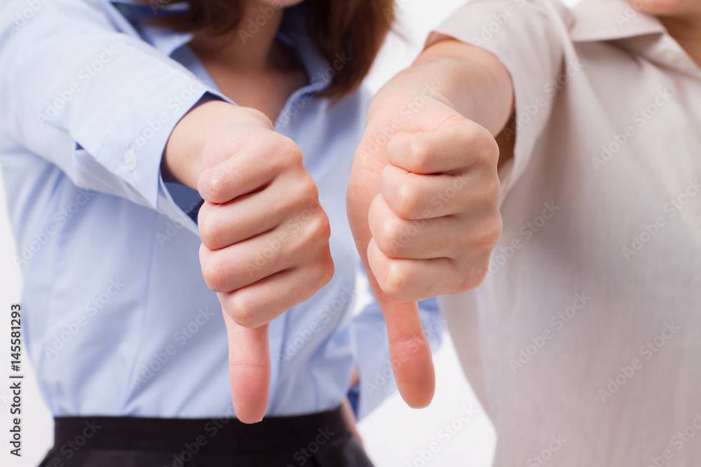 Fototapeta premium frustrated, angry women giving thumb down pose
