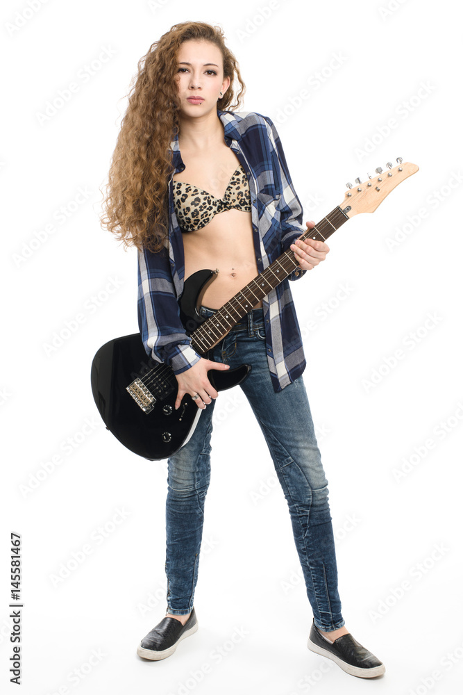 Young guitarist girl posing on white background; Young guitarist girl posing on white background;
