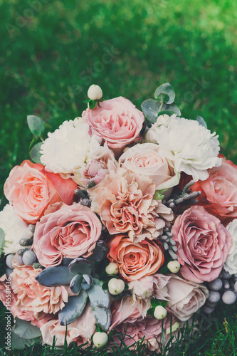 Wedding bouquet on grass with copy space