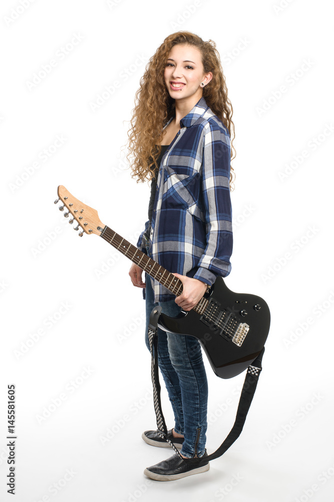 Young guitarist girl posing on white background; Young guitarist girl posing on white background;