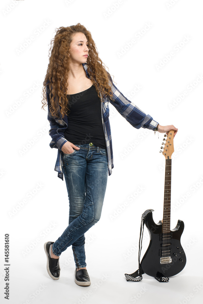 Young guitarist girl posing on white background; Young guitarist girl posing on white background;
