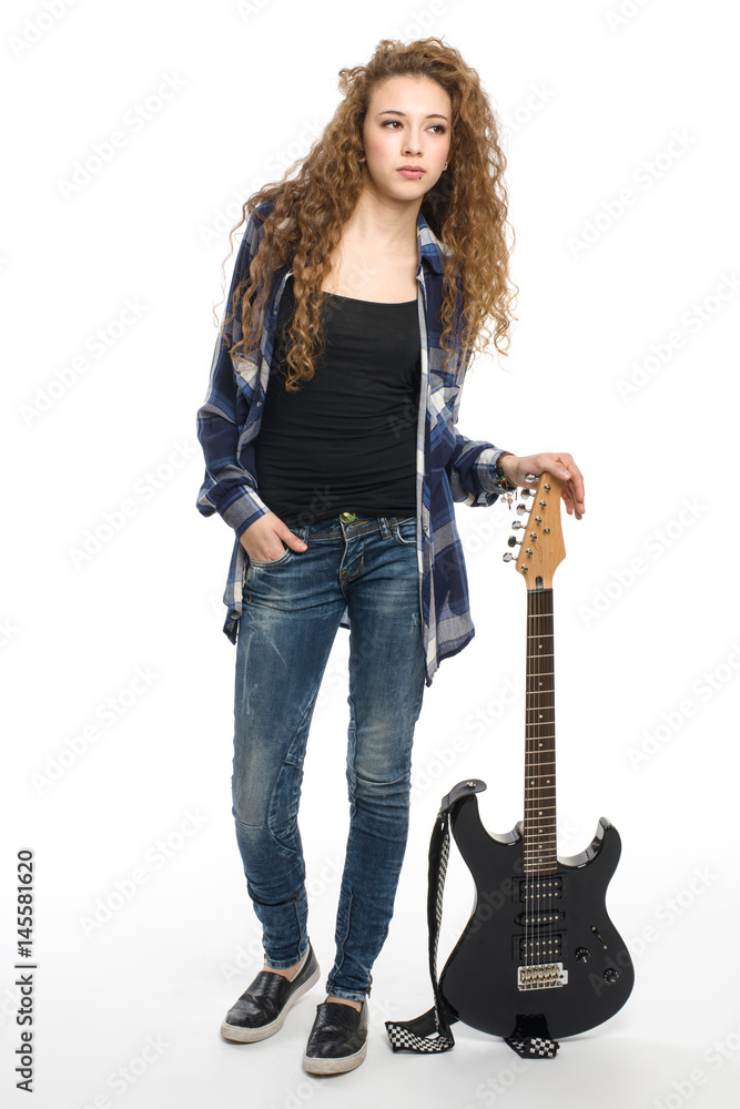 Young guitarist girl posing on white background; Young guitarist girl posing on white background;