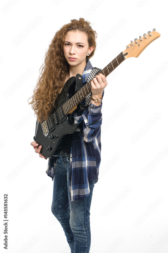 Young guitarist girl posing on white background; Young guitarist girl posing on white background;