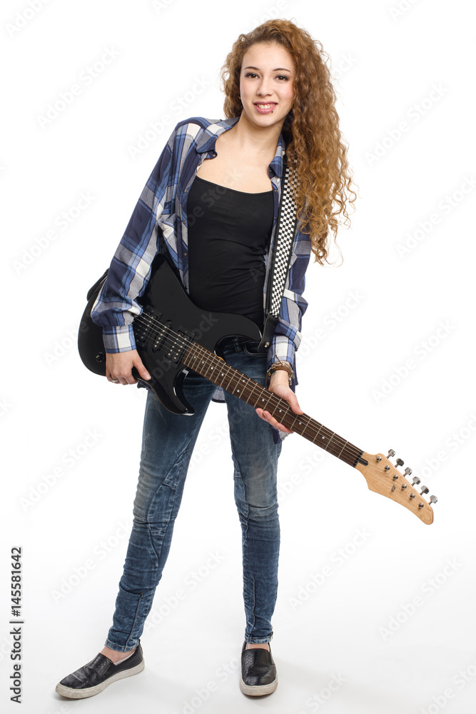 Young guitarist girl posing on white background; Young guitarist girl posing on white background;