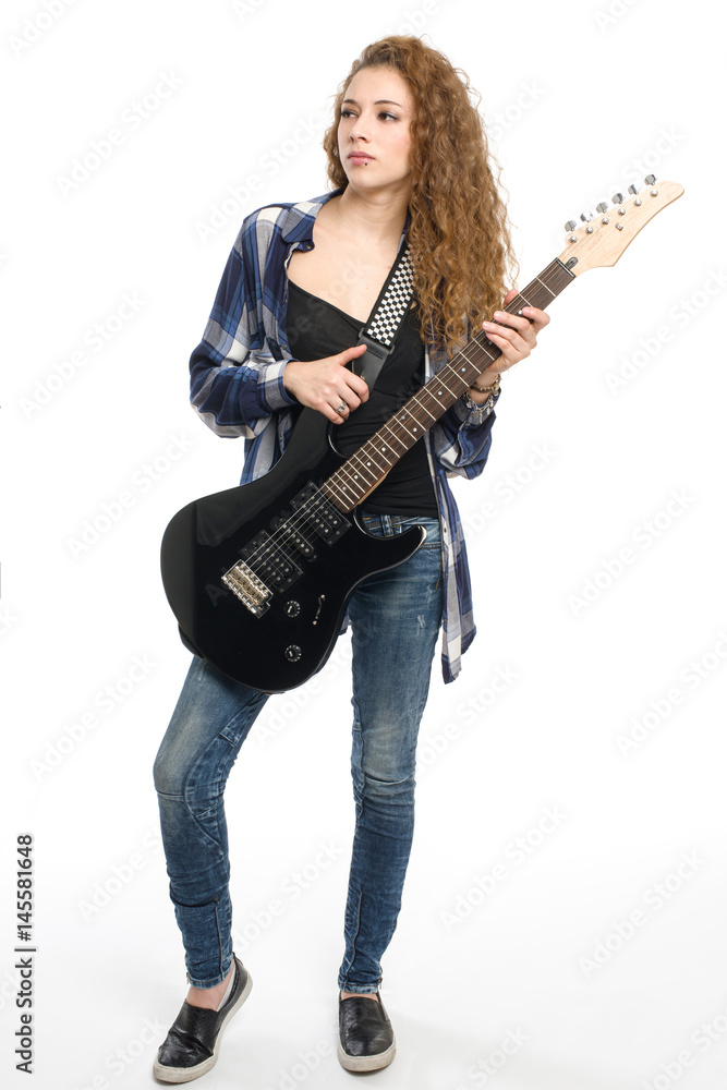 Young guitarist girl posing on white background;