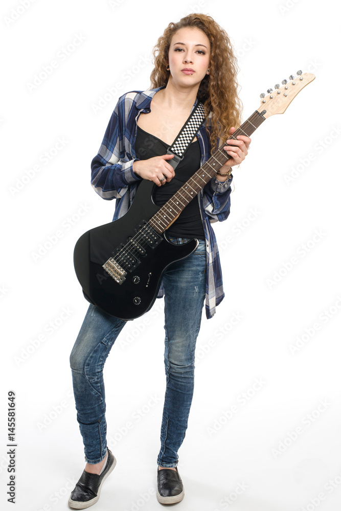 Young guitarist girl posing on white background; Young guitarist girl posing on white background;