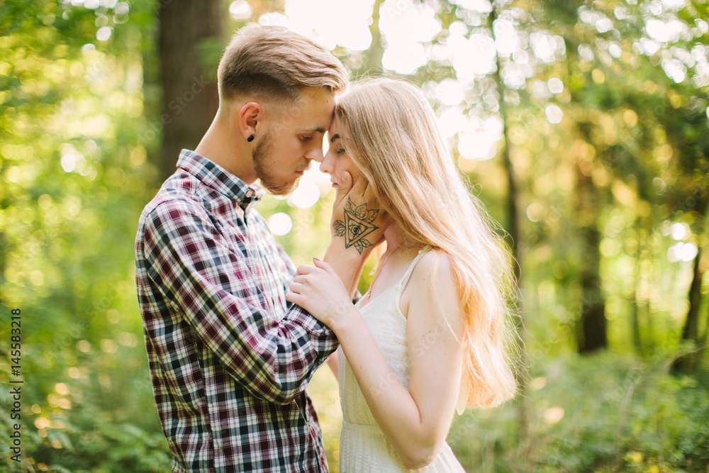Beautiful Love story in the woods. Portrait of young stylish couple. Beautiful Love story in the woods. Portrait of young stylish couple.