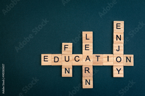 Wood block educaiton word over backboard school. Education word formed by educational wood block. Education word concept for background. photo