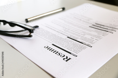 resume on wooden table.