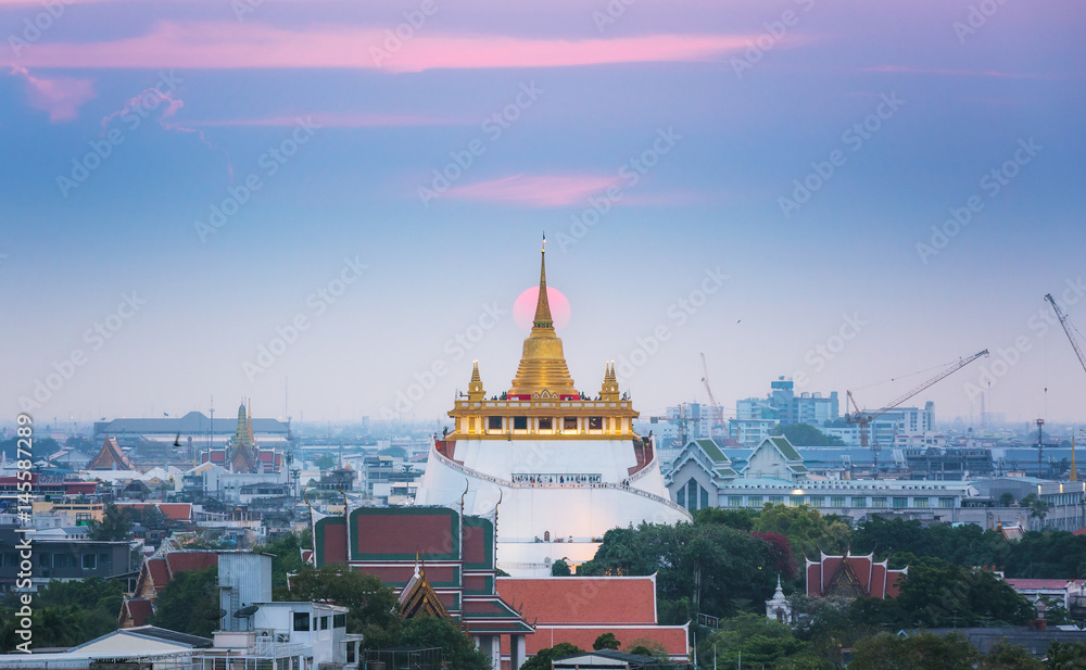 Golden mountain or Wat sraket with sunset background. This is landmark in Bangkok, Thailand.