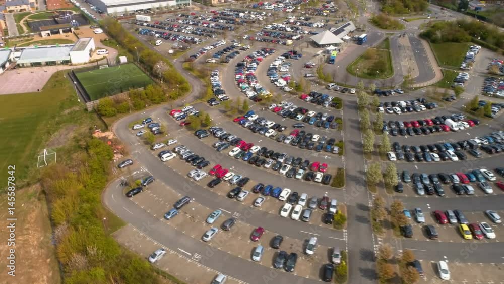 Aerial hypertimelapse of busy parking lot, bus stop, Park & Ride Aerial hypertimelapse of busy parking lot, bus stop, Park & Ride