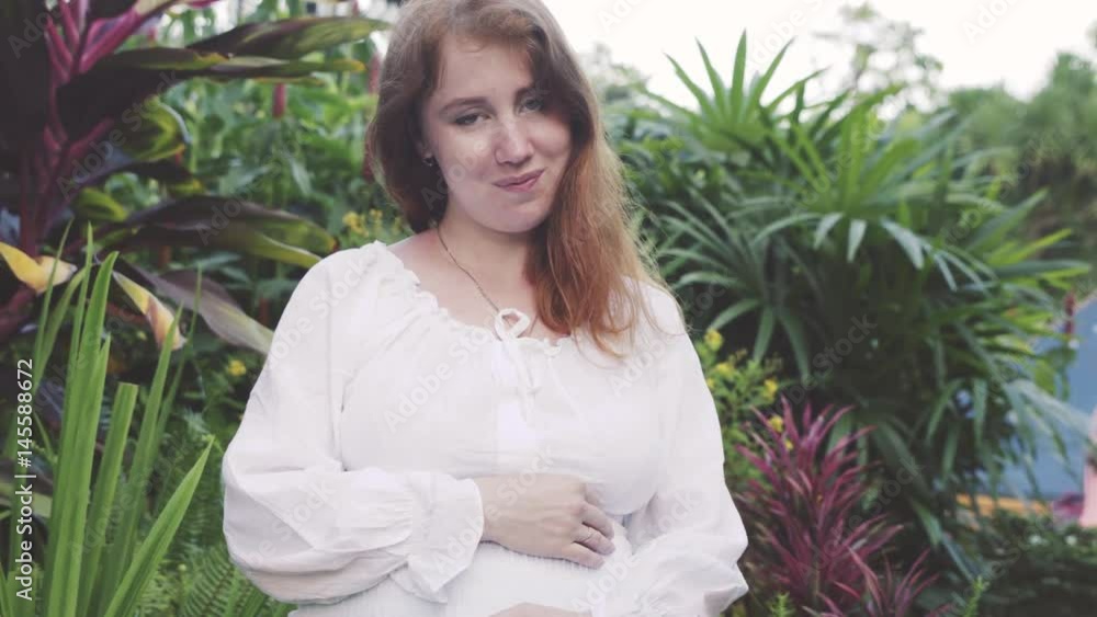 Young happy pregnant woman relaxing and enjoying life in nature. Young happy pregnant woman relaxing and enjoying life in nature.