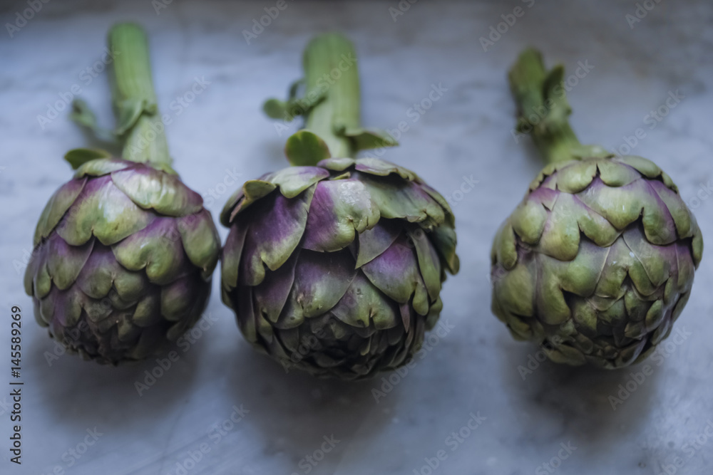 artichoke on marble table artichoke on marble table