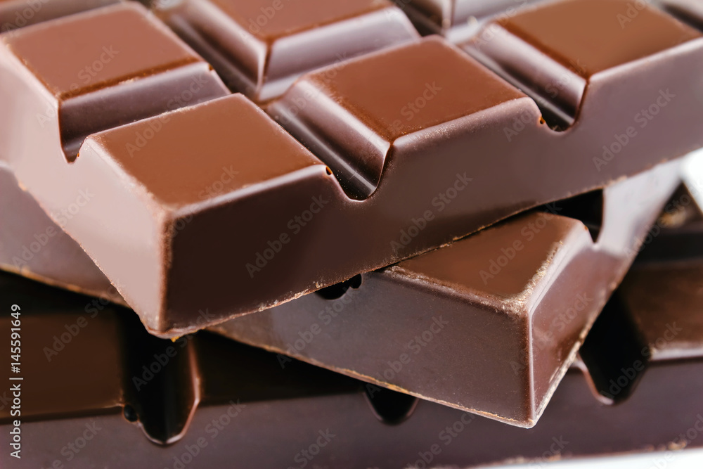 Three pieces of bitter, dark chocolate bar, close-up view Three pieces of bitter, dark chocolate bar, close-up view