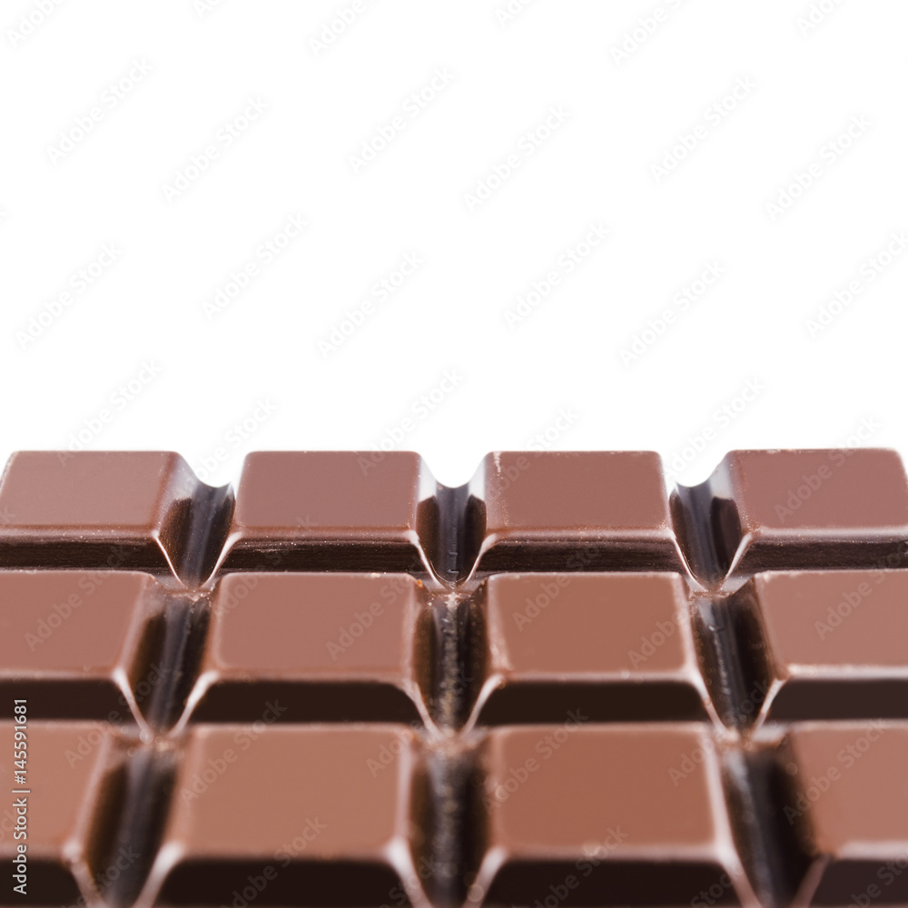 Fototapeta premium Bitter, dark chocolate bar, isolated on white background, close-up view with copy space