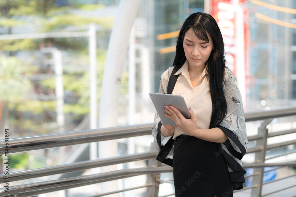 Asian Business Woman on Work Activity using ComputerTablet Asian Business Woman on Work Activity using ComputerTablet
