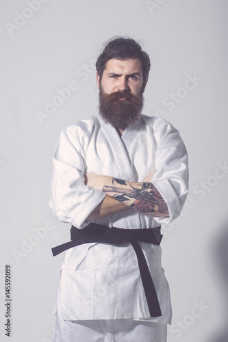 bearded karate man, brutal caucasian serious hipster in kimono