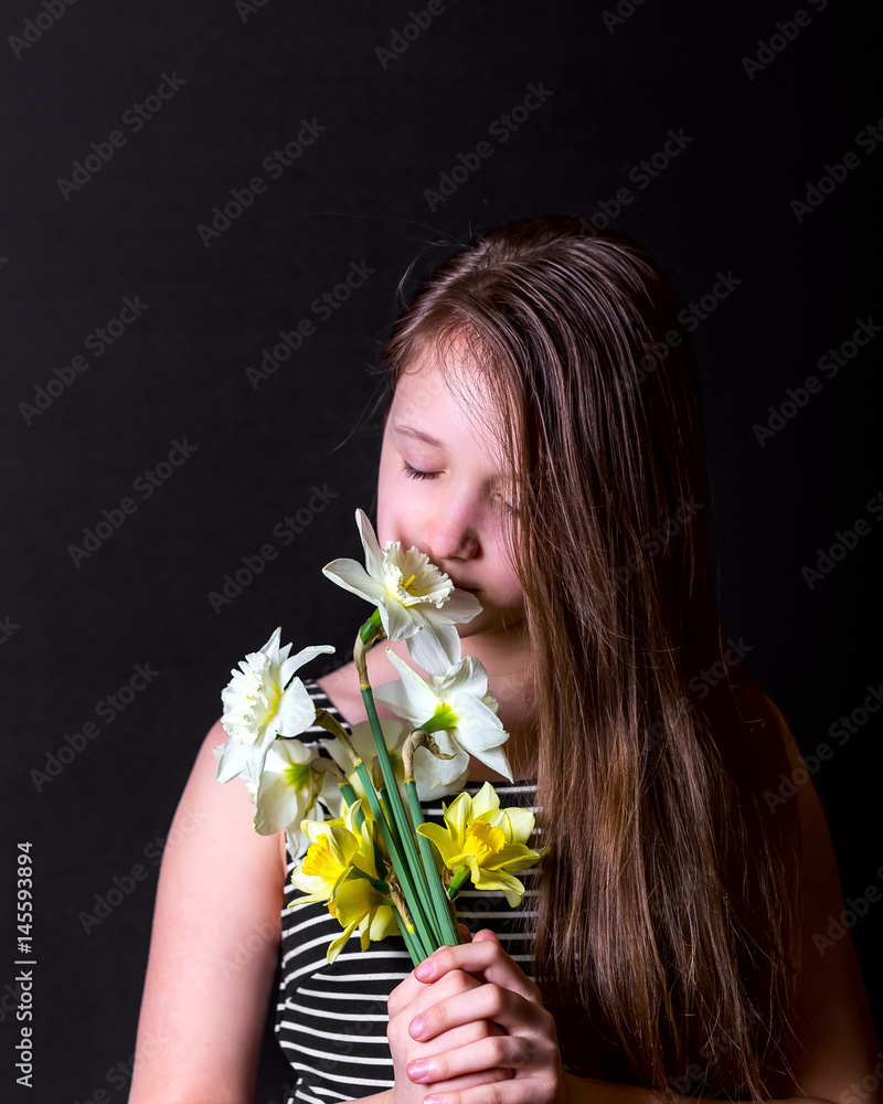 Teen girl Inhale aroma of bouquet of daffodils Teen girl Inhale aroma of bouquet of daffodils