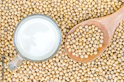 top view of soy milk and soy beans with soy beans background