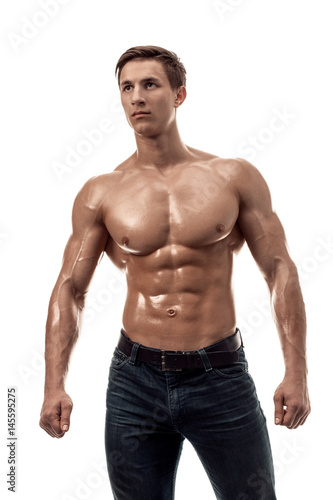 Muscular handsome young man with naked torso. Isolated on white background. © nazarovsergey