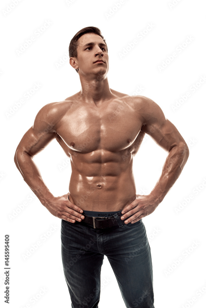 Fototapeta premium Muscular handsome young man with naked torso. Isolated on white background.
