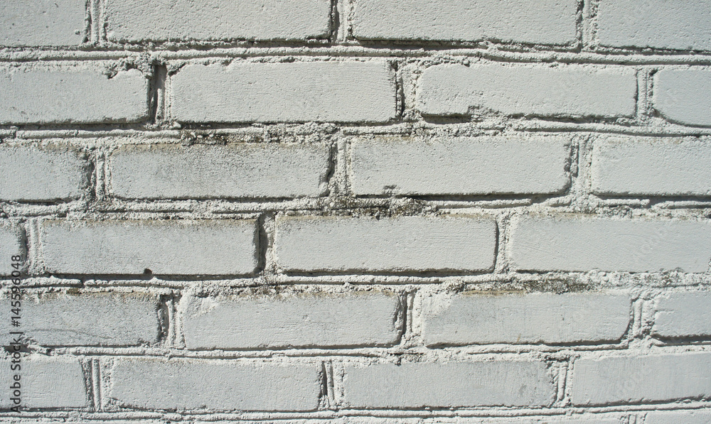 Fototapeta premium old white weathered brick wall, background or texture.