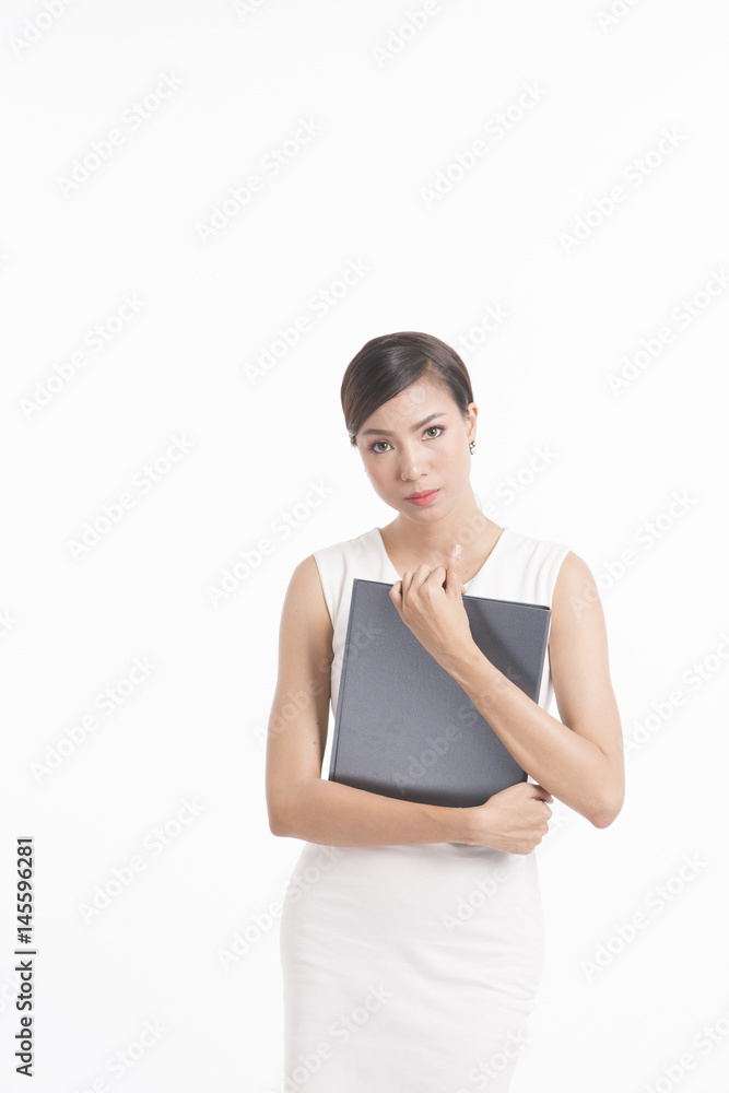 Business woman standing, holding file and waring white dress Business woman standing, holding file and waring white dress