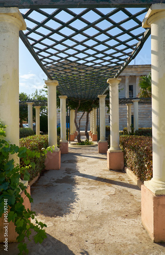 The colonnade passageway with pergola in the garden of Villa Bighi. Kalkara. Malta