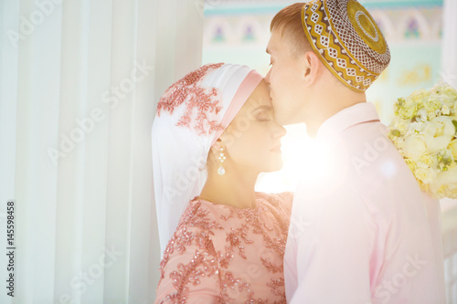 Islamic couple in the mosque on a wedding ceremony photo