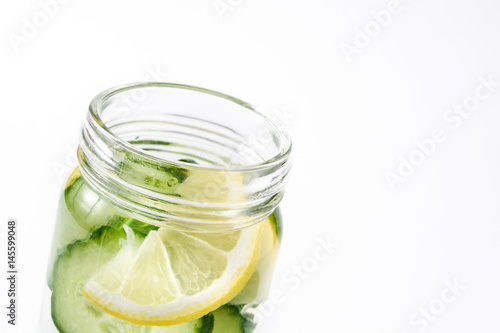 Detox water with cucumber and lemon isolated on white background    