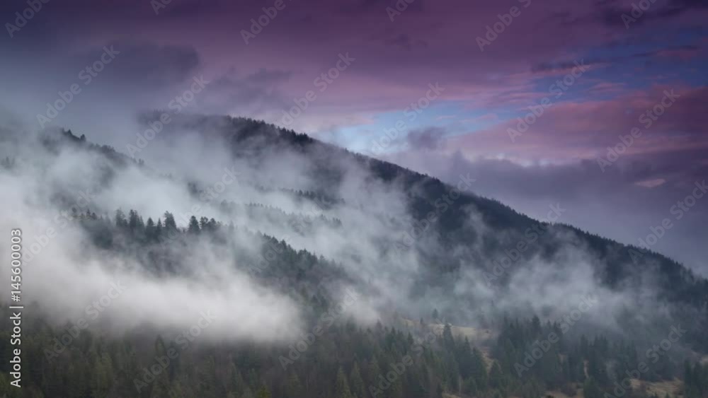 Fog and clouds mountain valley landscape. Magic spring evening at mountains range Fog and clouds mountain valley landscape. Magic spring evening at mountains range