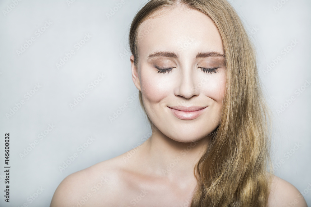 Face of young blonde beautiful girl with makeup and long hair Face of young blonde beautiful girl with makeup and long hair